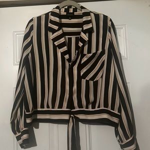 White, yellow and black striped shirt. With buttons and front tie.